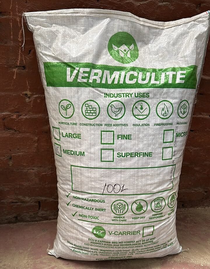 Exfoliated vermiculite for feed premix and carrier applications
